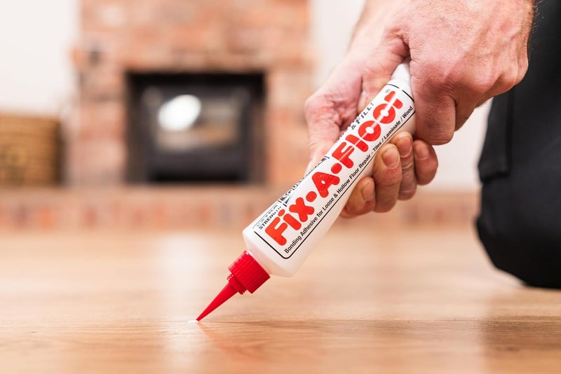Fix-A-Floor لاصق الإصلاح الأصلي الشامل لجميع أنواع البلاط الخفيف، المجوف، والصاخب والخشب. فقط قم بالحفر والملء! سهل الاستخدام! مصنوع في الولايات المتحدة الأمريكية! - Image 2